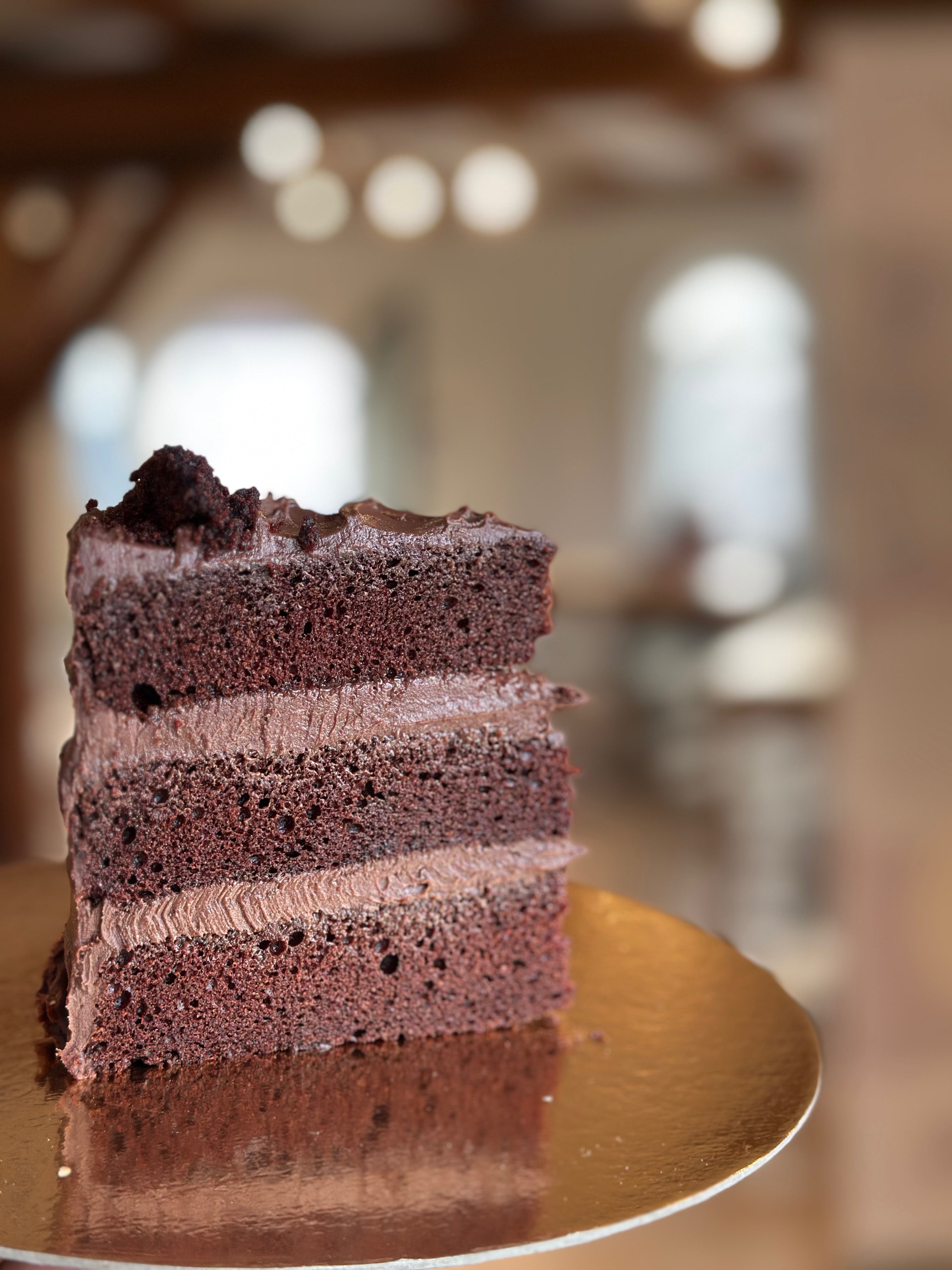 Slice of Mathilda Cake, the vegan dark chocolate cake from our vegan bakes collection, baked by Gluten Tag in Copenhagen.