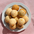 Plate of gluten-free chipa, the traditional South American cheese bread, baked and ready to eat, made by Gluten Tag in Copenhagen.