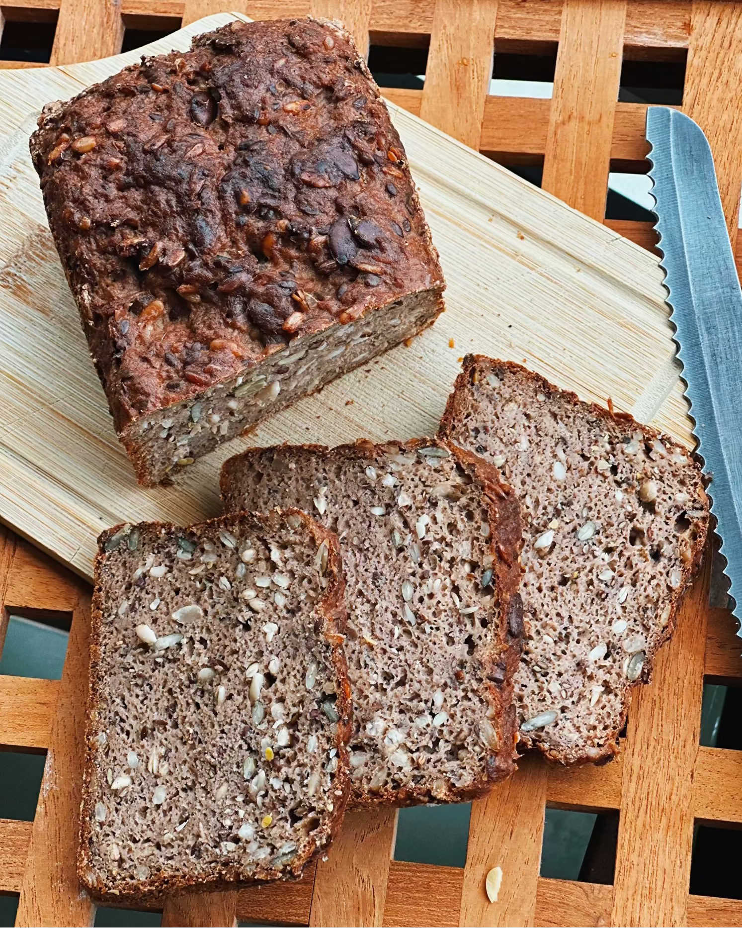 Sliced gluten-free vegan rugbrød with seeds visible in the crumb, the Danish sourdough classic baked by Gluten Tag in Copenhagen.