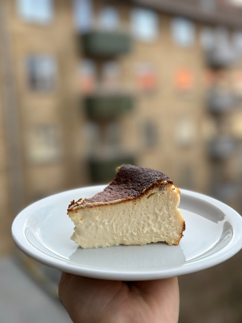 Slice of lactose-free gluten-free Basque cheesecake showing soft creamy center, baked by Gluten Tag in Copenhagen